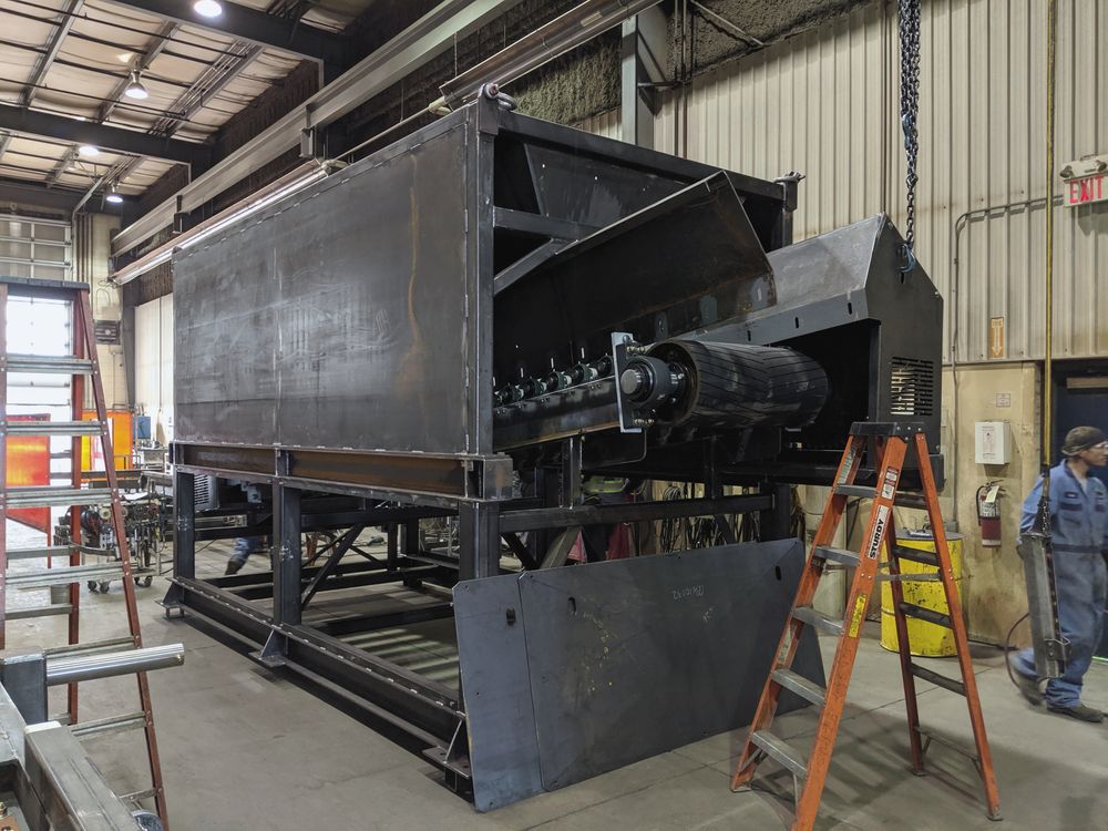 Fabricated conveyor equipment staged in the shop for inspection