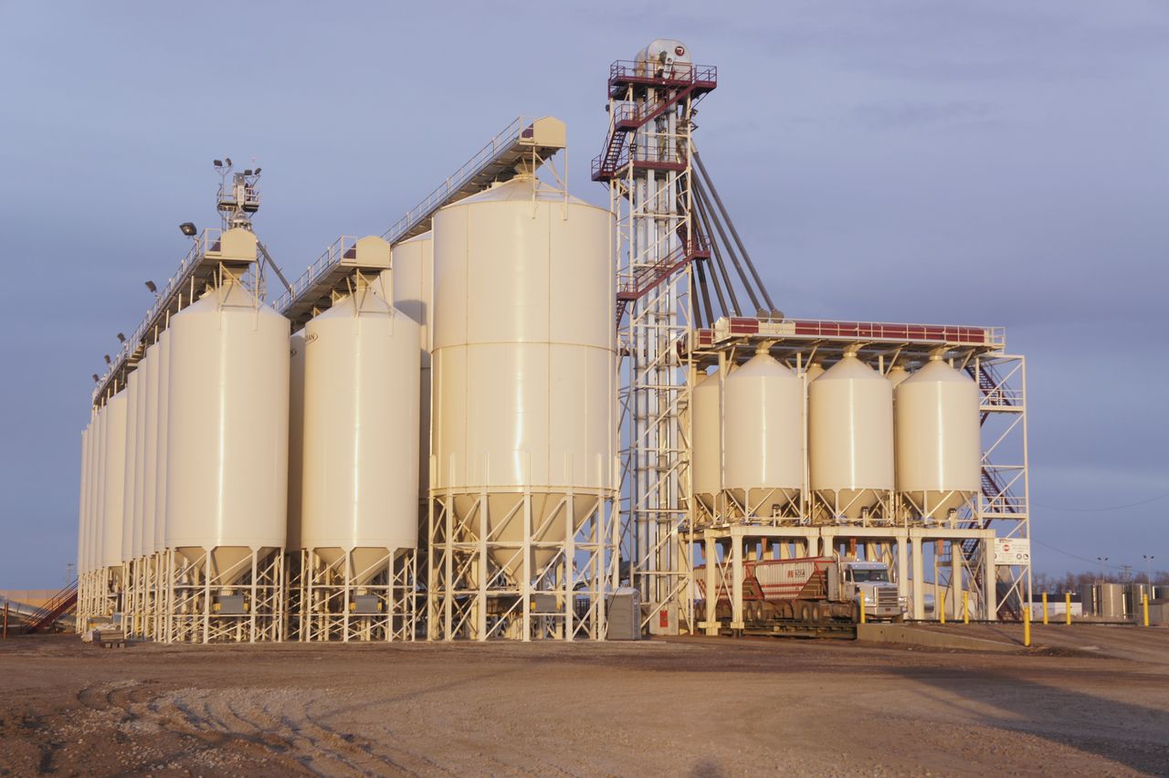 Transload silo facility at golden hour beside the new staging tracks